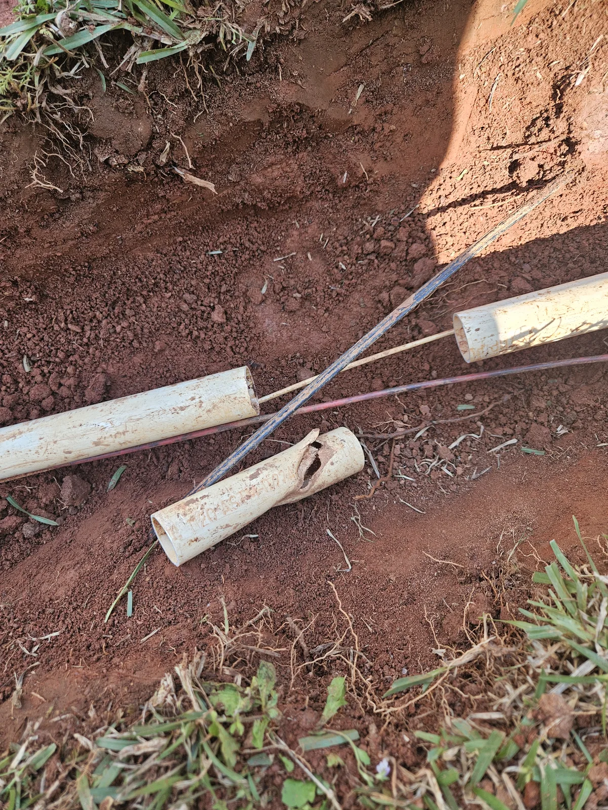 Broken irrigation pipe with trench exposed during repair in Newton County GA