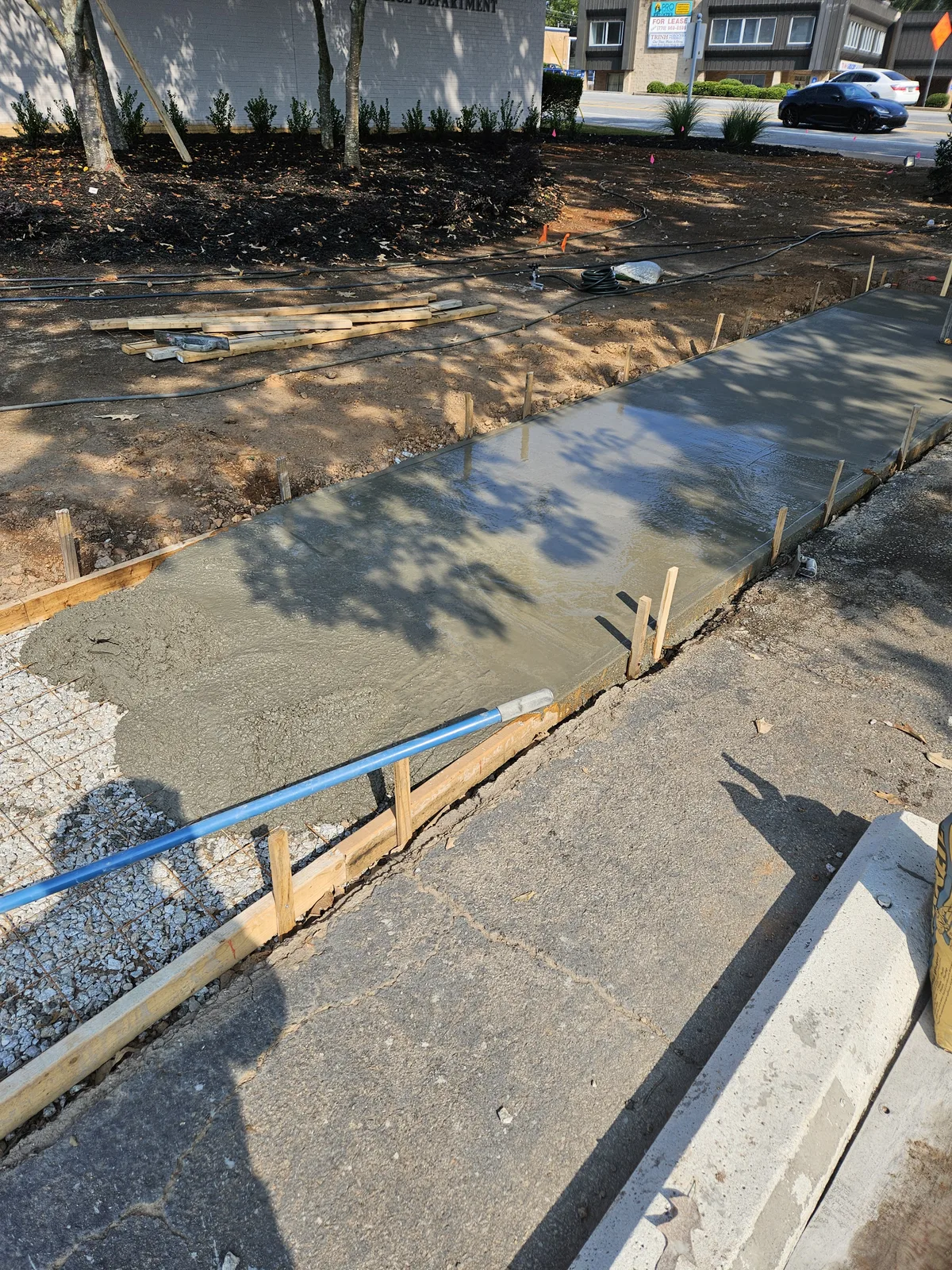 Fresh concrete being poured for a sidewalk in Newton County Georgia