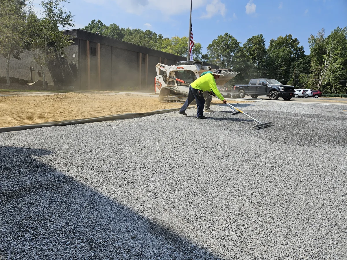 Liba crew clearing and grading a site with a skid steer in Newton County, GA